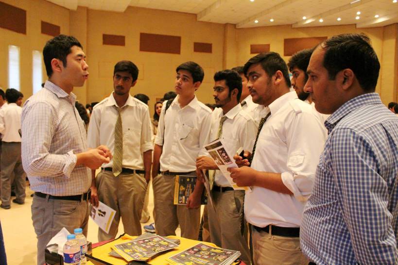 Representatives of U.S. universities discussing U.S. study options with Pakistani students