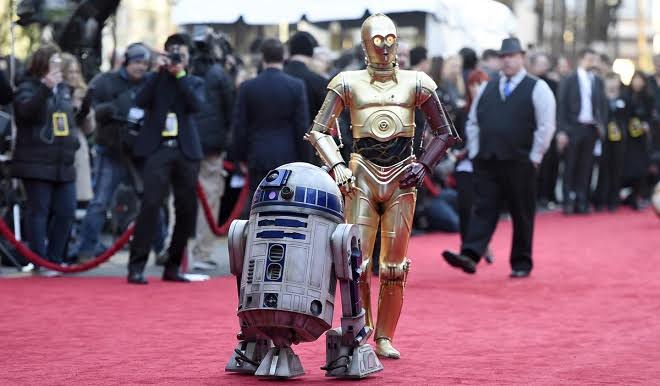 Film characters R2-D2, left, and C-3PO arrive at the world premiere of "Star Wars: The Force Awakens" at the TCL Chinese Theatre on Monday, Dec. 14, 2015, in Los Angeles. 