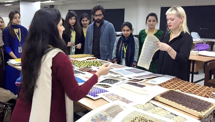 Students at Pakistan Institute of Fashion and Design sharing their projects with Heidi