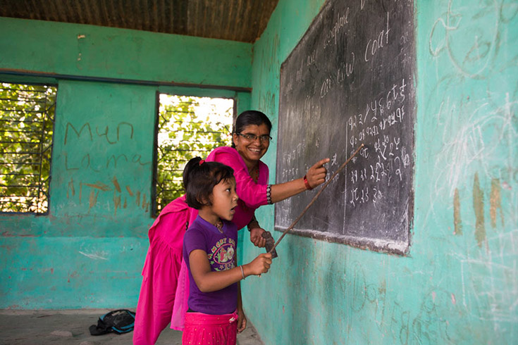 Student and teacher at a school in Nepali village. Photo by Susan Hale Thomas