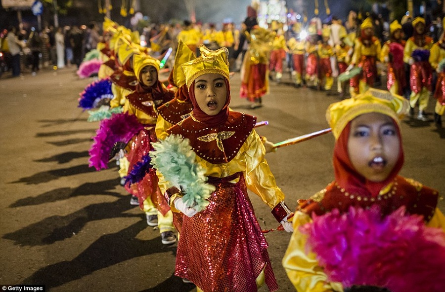 There were happier scenes in Yogyakarta, Indonesia, where children paraded through the streets to mark the end of Ramadan.