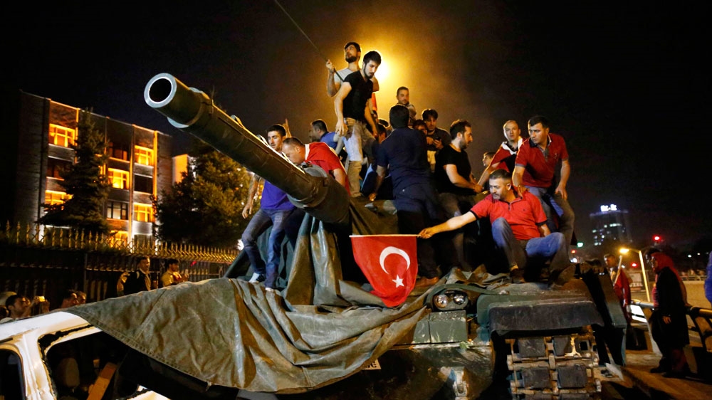 People stand on a Turkish army tank in the capital Ankara. Photo: Tumay Berkin/Reuters