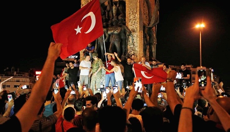 Supporters of Turkey's President Recep Tayyip Erdogan, gather, waving Turkish flags, in Istanbul