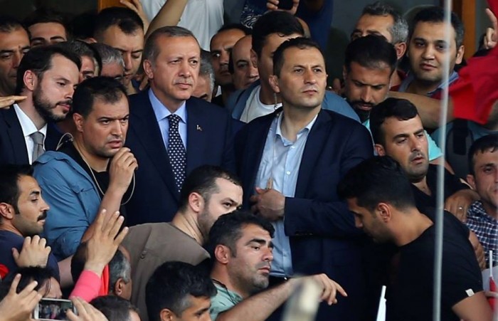 Turkish President Recep Tayyip Erdogan (centre) and his supporters at Istanbul airport. 
