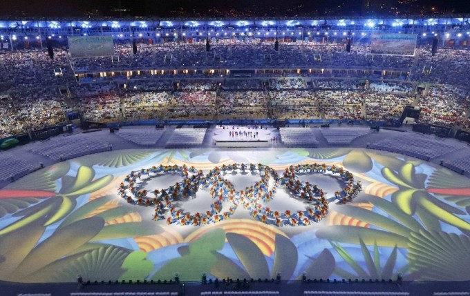 Performers form the Olympic rings at the closing ceremony of Rio 2016.