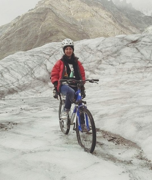 Pakistan's Samar Khan cycling on 4,500 meters high Biafo Glacier in the Karakoram Mountains of Gilgit-Baltistan.