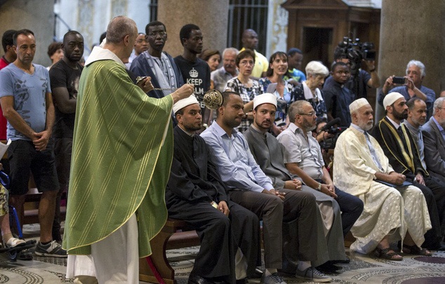 Muslims attend a Mass in Rome's Saint Mary in Trastevere church, Italy, Sunday, July 31, 2016. (Massimo Percossi/Ansa via AP)