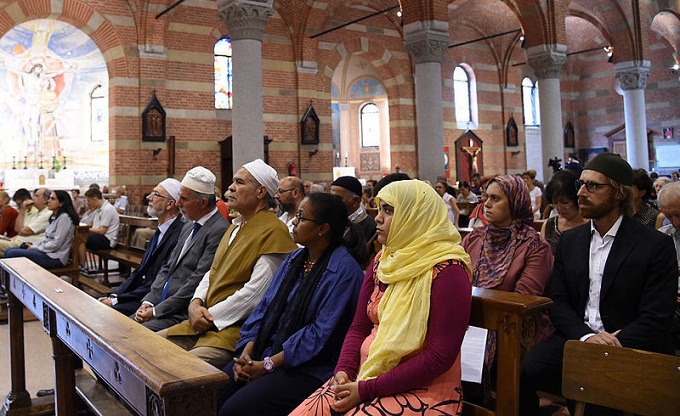 Members of the Muslim community attend a mass in the Catholic church of Santa Maria of Caravaggio on Sunday in Milan, Italy. (Pier Marco Tacca/Getty Images)
