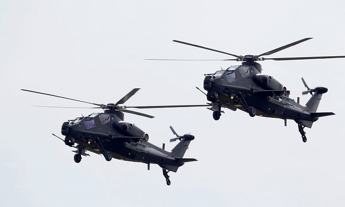 Pakistani Cobra helicopters fly past during the Pakistan Day military parade in Islamabad