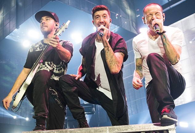 Chester Bennington (far right) performs alongside his Linkin Park bandmates Mike Shinoda and Austin Carlile in London in 2014