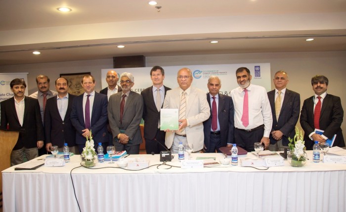 Minister for Climate Change Mushahid Ullah Khan and UNDP Representative Neil Buhne with other speakers on the launch of Financing framework report in Islamabad. Photo by UNDP Pakistan