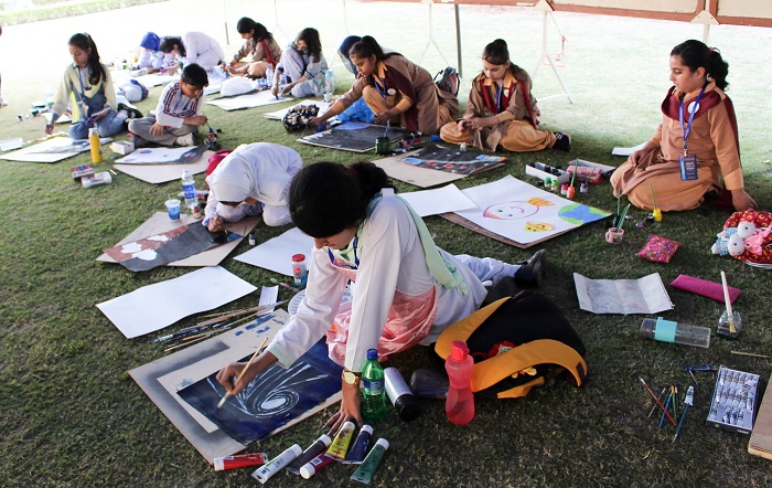 Students working on their artistic pieces at Space Fine Arts contest. Photo by Sana Jamal