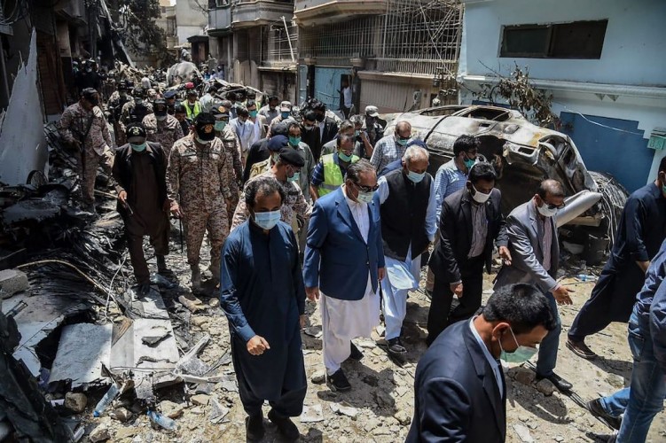 A PIA Airbus jet with 99 people aboard crashed into a crowded residential district of the city of Karachi on Friday afternoon after twice trying to land at the airport. Photo: AFP