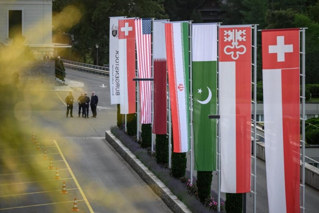 Flags of Switzerland, the United States, Qatar, Pakistan and the local Swiss canton of Nidwalden